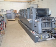 Five color Heidelberg offset press, shown from the feeder end.