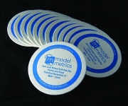 One color letterpress printed coaster, used as a corporate event invitation.